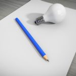Paper, bulb and pencil